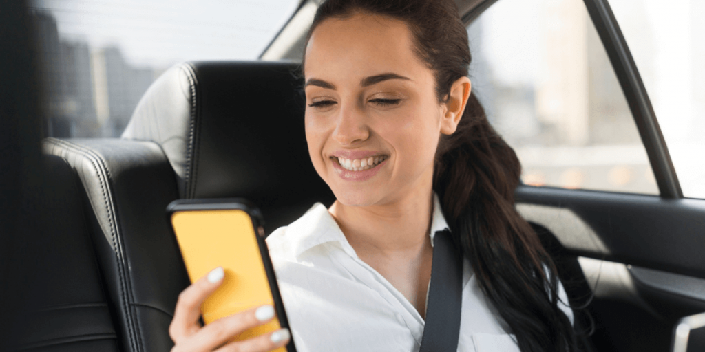 Women is using Local Taxi Over Ride-Share Apps for Airport Transfers.